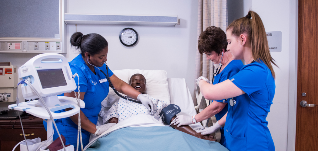 Students performing nursing procedures